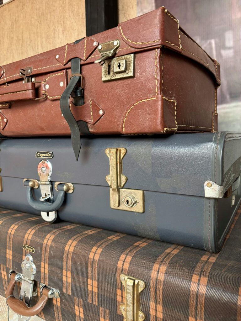 pexels photo 30161427 30161427 Stack of vintage suitcases showcasing classic design in Dubai, UAE.